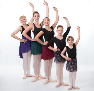 Northwest Ballet dancers of five different ages posed together